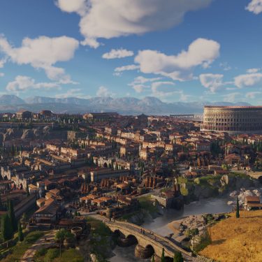 Im Bild aus dem Anno 117: Pax Romana-Test ist eine beeindruckende römische Stadt aus der Vogelperspektive zu sehen. Im Zentrum thront das Kolosseum, umgeben von roten Ziegeldächern, Tempeln, Aquädukten und Stadtmauern. Im Vordergrund fließt ein Fluss durch eine fruchtbare Landschaft mit Feldern und Brücken. Die Szene wirkt friedlich und majestätisch bei klarem Himmel.