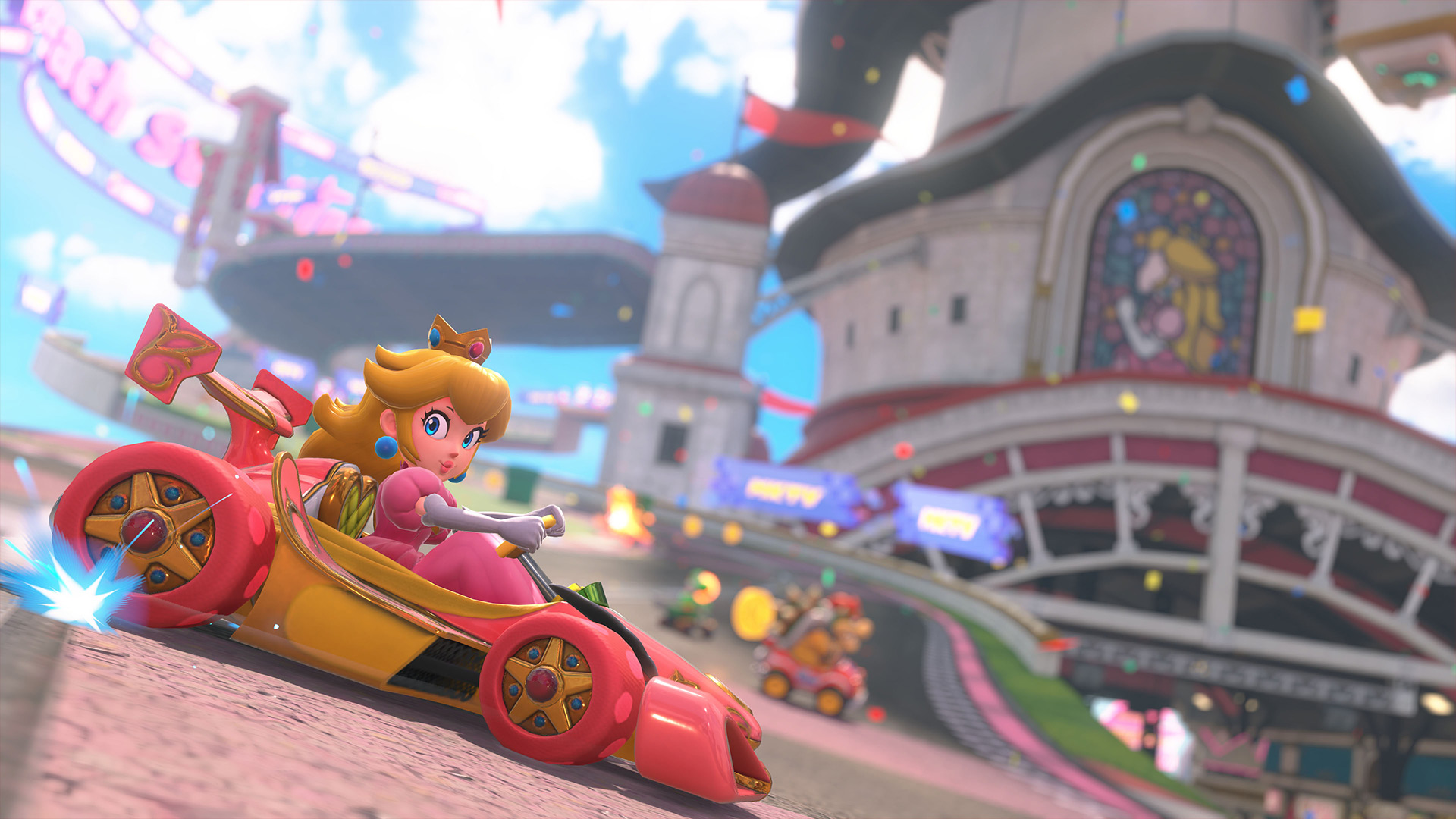 Das Bild in dem Artikel zum Mario Kart World-Test zeigt Prinzessin Peach in einem rosafarbenen Kart auf einer königlichen Rennstrecke. Im Hintergrund ist ein Schloss mit einem Fensterbild von Peach zu sehen. Die Szene wirkt farbenfroh und dynamisch, mit weiteren Fahrer:innen im Rennen.