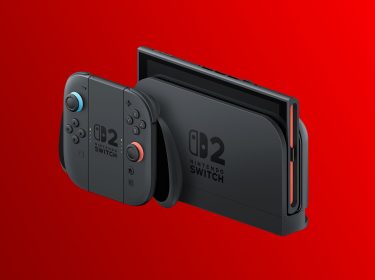 Die Nintendo Switch 2 im stationären Modus mit zwei Joy-Cons vor rotem Hintergrund.