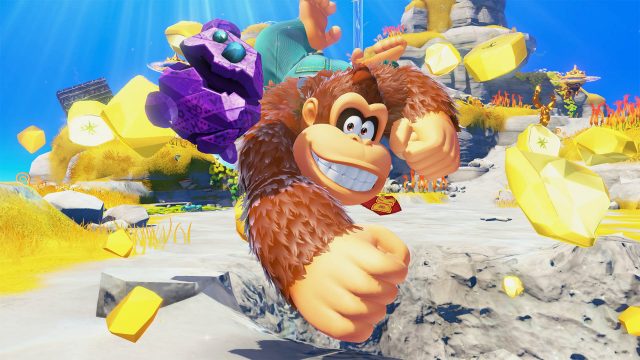 Donkey Kong zerstört einen Gesteinbrocken im Spiel „Donkey Kong Bananza“.