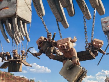 Auf dem Bild in dem Artikel zu „Ein Minecraft Film 2“ sind fliegende Kreaturen zu sehen, die hölzerne Plattformen mit mehreren Piglins durch die Luft tragen.