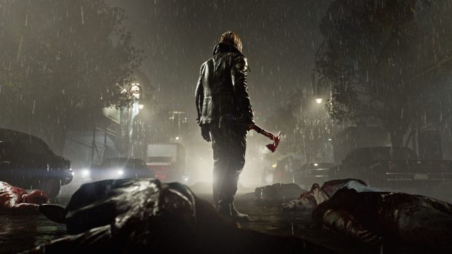 Leon S. Kennedy steht im Dunkeln auf einer Straße. Um ihn herum liegen erledigte Untote, er hält eine Axt in der Hand.
