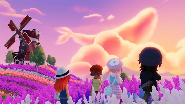 Mehrere Spielende betrachten einen Sonnenuntergang in „Heartopia“.