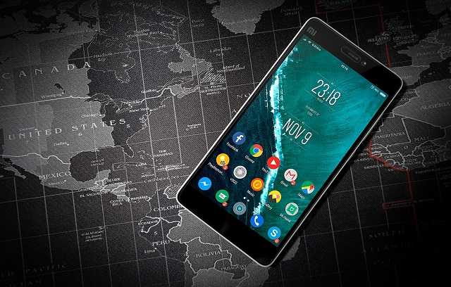 Android smartphone lying on a world map