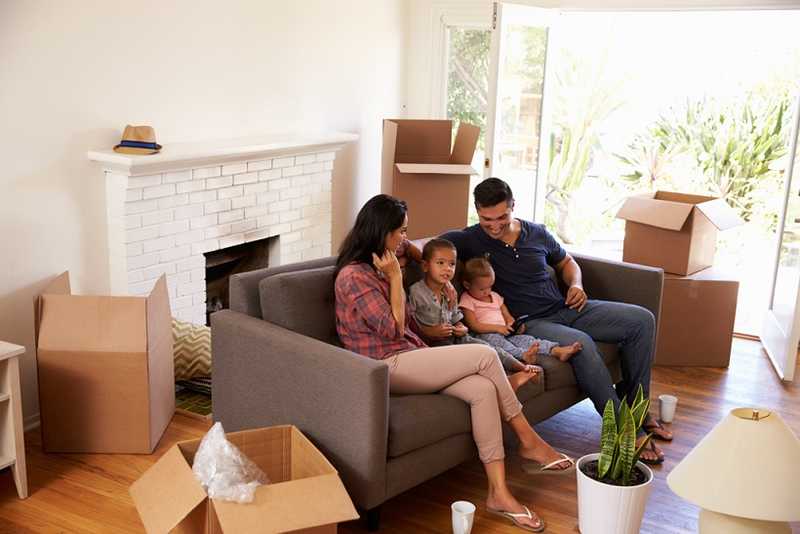 A family siting on the furniture