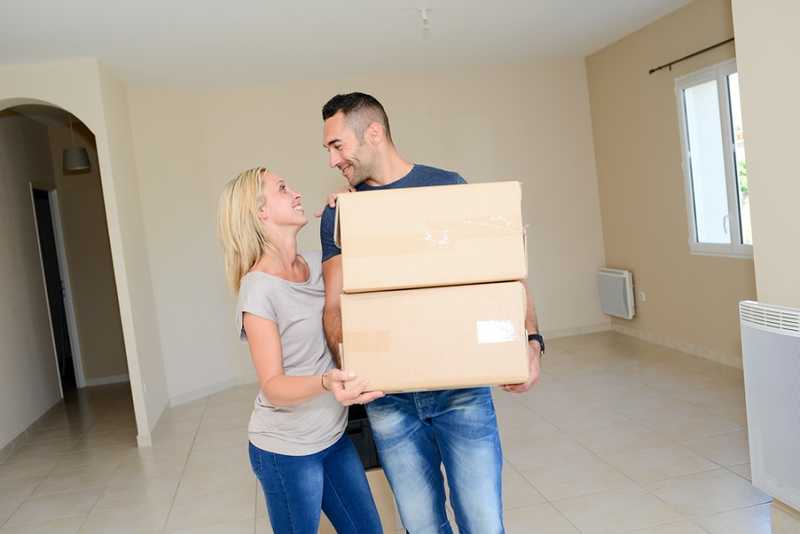 A man and a woman packing up their belonings