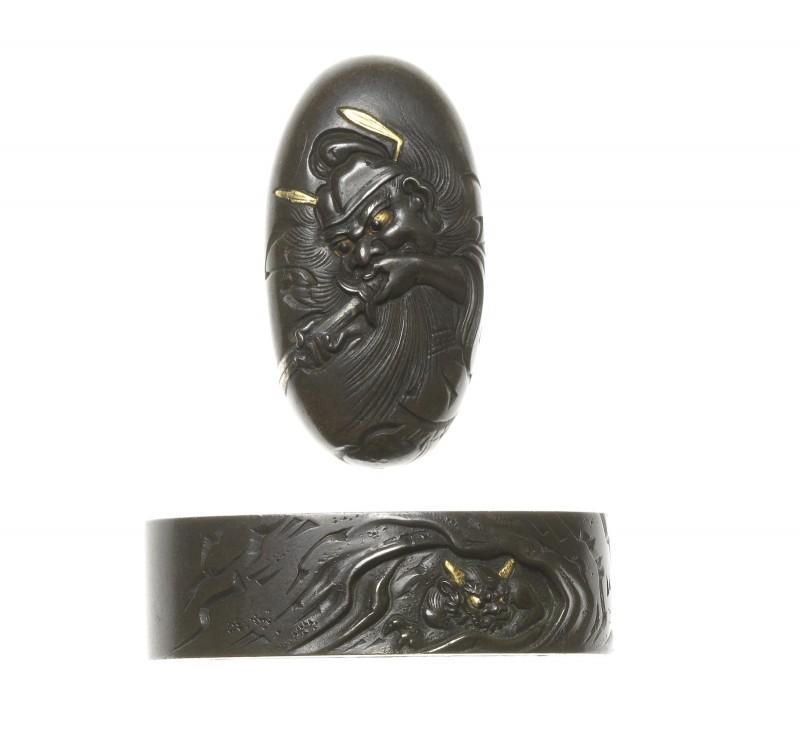A dark shibuichi fuchi-gashira
Hamano School, 19th century
Carved on the fuchi with an oni hidin ...
