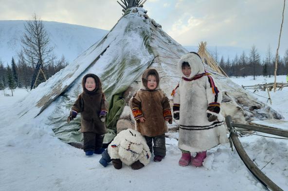 Photo by Sergei Shilenko: https://www.pexels.com/photo/a-group-of-children-wearing-parkas-beside-a-tupik-12017743/